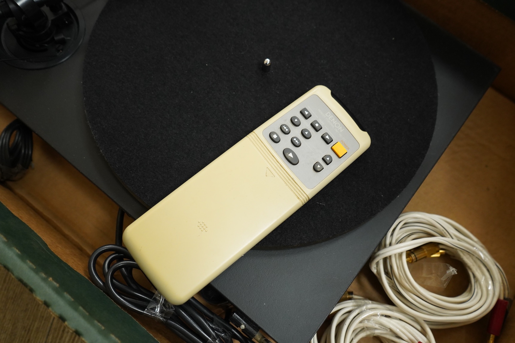 A collection of stereo equipment, including a Project P1 turntable record player, a Denon UPA-F10 integrated stereo amplifier with remote control, a boxed Kenwood KX-260 cassette tape player and a pair of Monitor Audio s